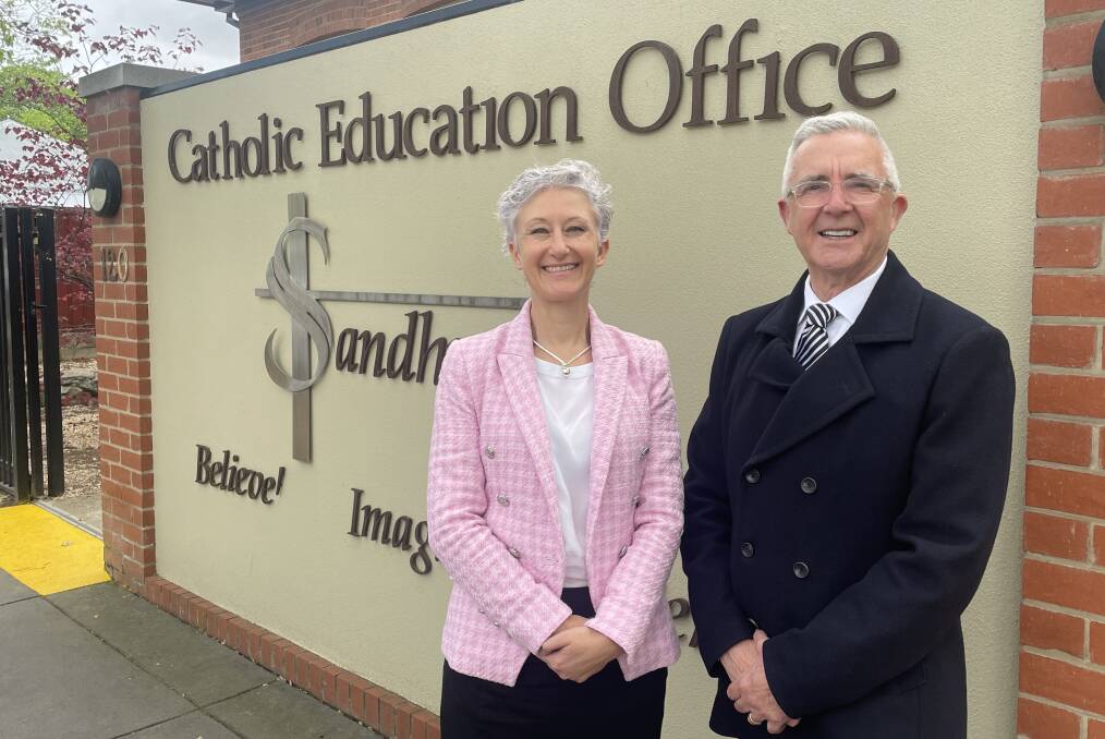 Incoming Catholic Education Sandhurst executive director Kate Fogarty with the outgoing Paul Desmond at the offices in Bendigo. Picture by David Chapman.