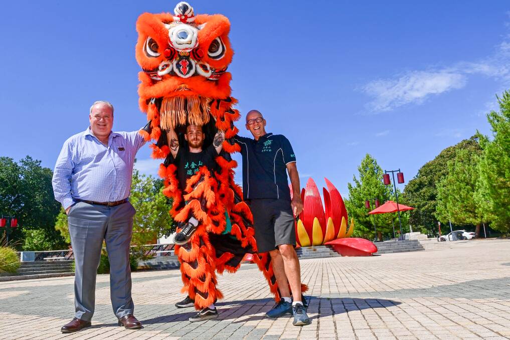 Golden Dragon Museum CEO Hugo Leschen (left) and Bendigo Chinese Association president Doug Lougoon (right) with LION Team member Shai Watts are ready to celebrate Chinese New Year next week. Picture: BRENDAN McCARTHY 
