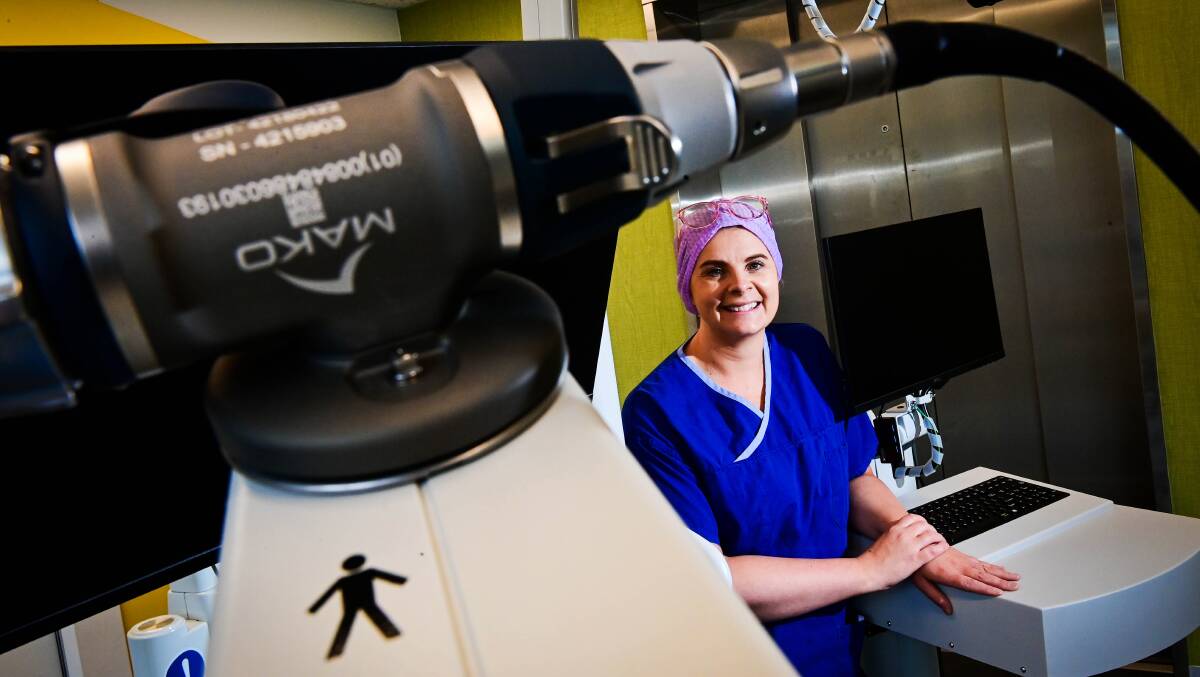 Orthopaedic associate nursing unit manager Alanna Sheehan with the MAKO surgical robot at St John of God Bendigo. Picture by Brendan McCarthy