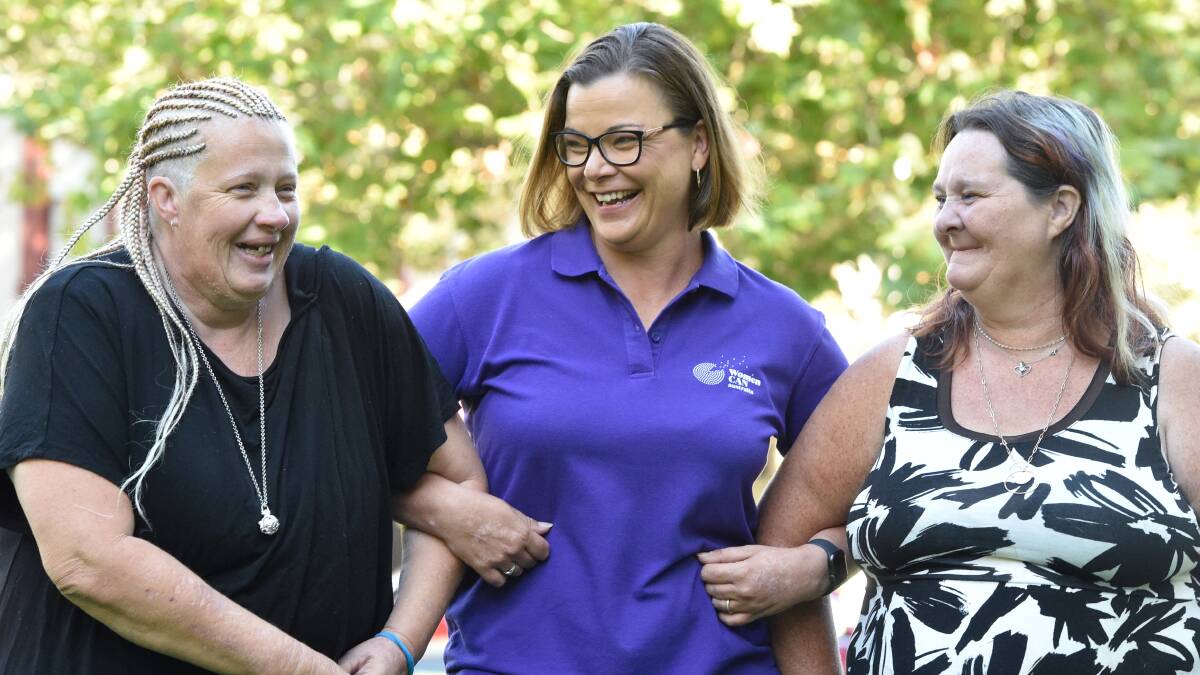 ARM IN ARM: Wendy Clark, WomenCAN project manager Sheryl Batrouney and Belinda Epworth. Wendy and Belinda are currently studying roles to be employed in the aged care sector.