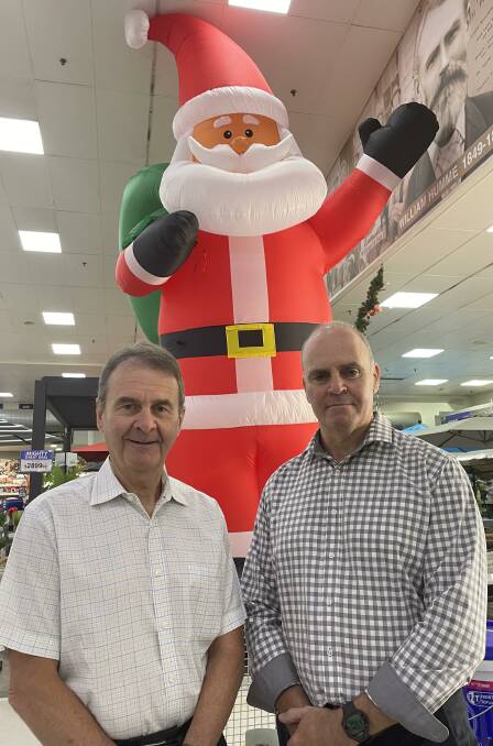 Hume & Iser Mitre 10 director Steve Iser and new chief executive officer David Pontell hope to see a few giant Santas on the front lawns of Bendigo houses in the Christmas Lights competition. 