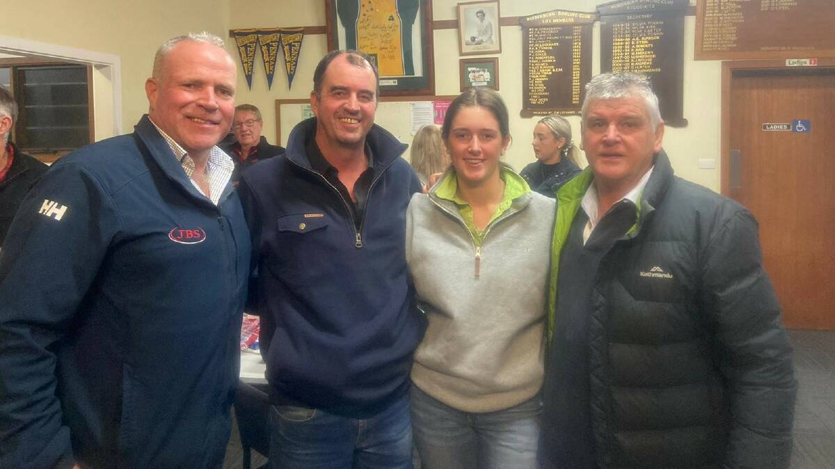 CATCH UP: JBS Australia's Steve Chapman (left) and Quality Wool's Brett Johnson (right) caught up with clients Grant and Alex Langley during Quality Wools 30th anniversary
celebration at the Wedderburn Lawn Tennis Club.