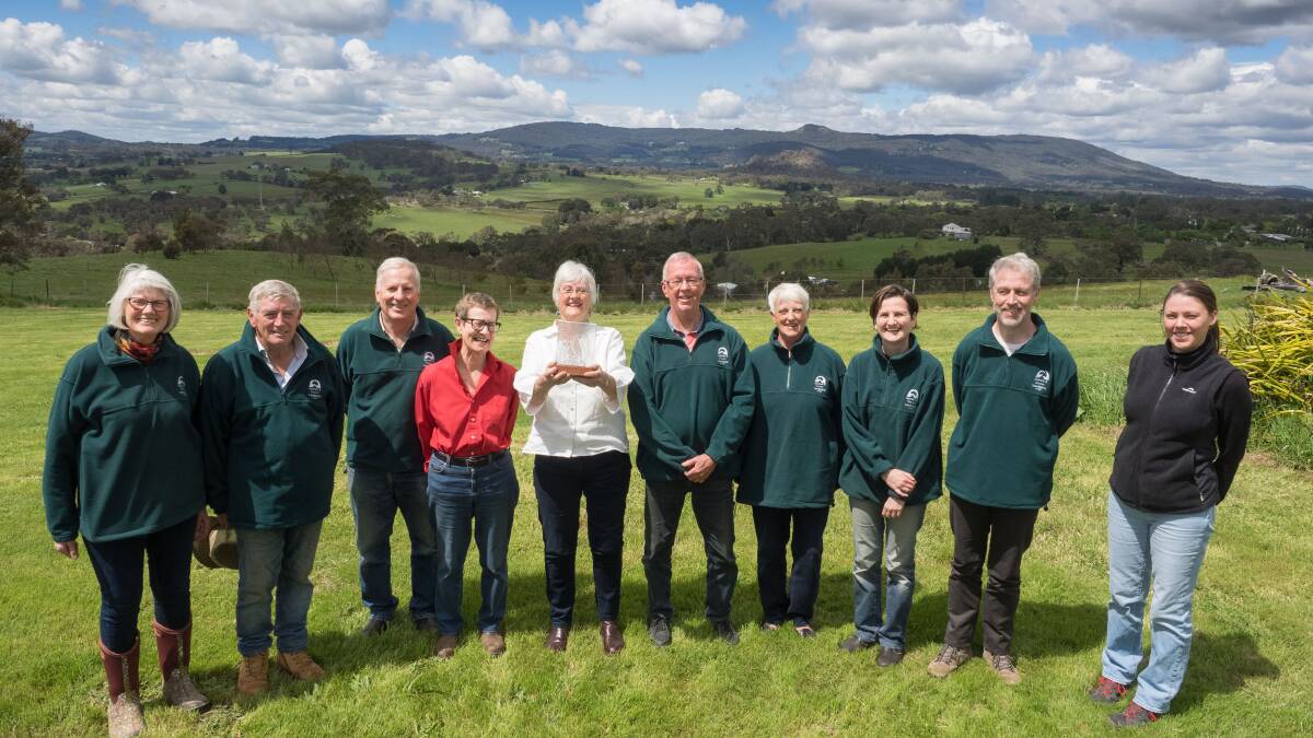 Newham and District Landcare Group members with the state award. From left is Alice Aird, Hilary Roberts, Karl Kny, Penny Roberts, Helen Scott with award, Howard Stirling, Sue Massie, Natasha Gayfer, Rob Lawrence, UDCLN facilitator Clare Watson.