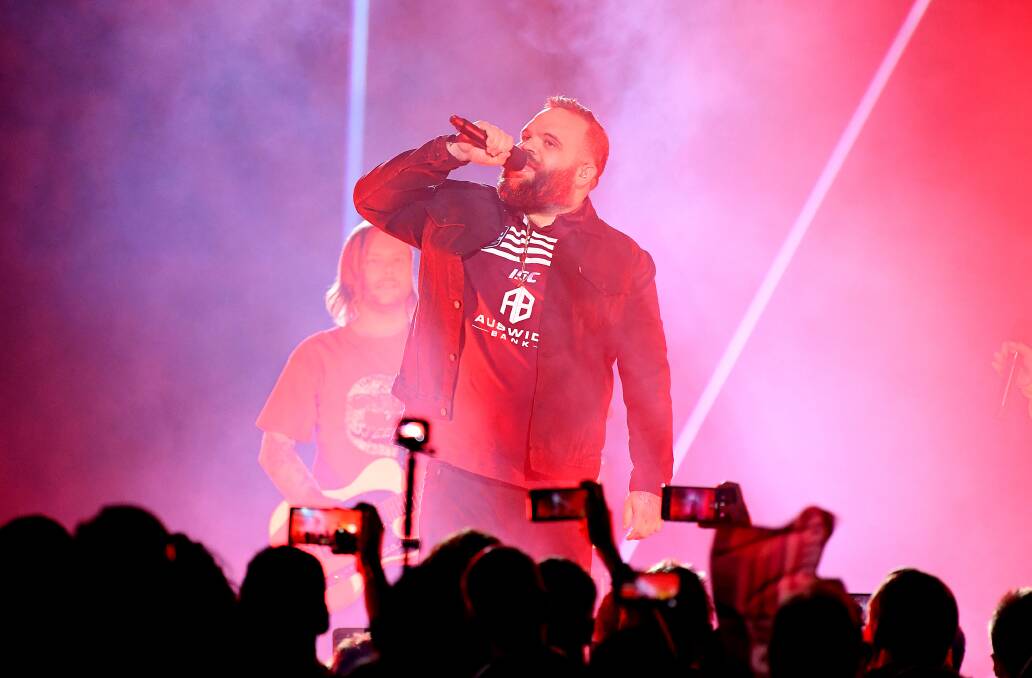 Rap artist Briggs performs prior to Game 1 of the 2019 State of Origin series between the NSW Blues and the Queensland Maroons at Suncorp Stadium in Brisbane, Wednesday, June 5, 2019. (AAP Image/Dave Hunt) 
