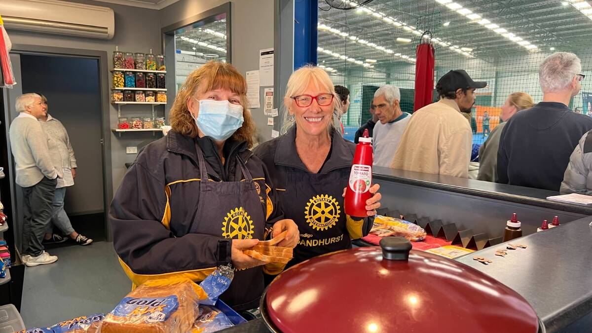 SNACKS: Rotary members supplied the classic sausage sizzle for the spent athletes. Picture: Maddy Fogarty
