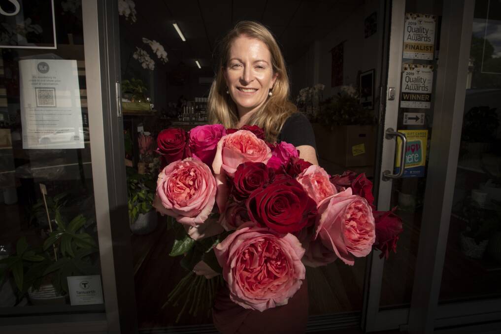 ROSES: Eliza Fagan from Designer Bunches prepares for a busy Valentine's Day. Photo: Peter Hardin