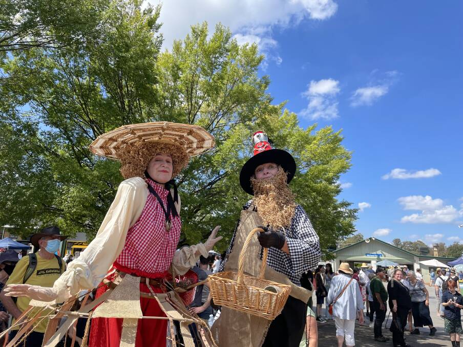 Tall tales: stilt walkers Jill of all Trades and Jack of all Trades from Public Mischief Australia entertained the crowds at the Lost Trades Fair. Picture: BRENDAN MCCARTHY