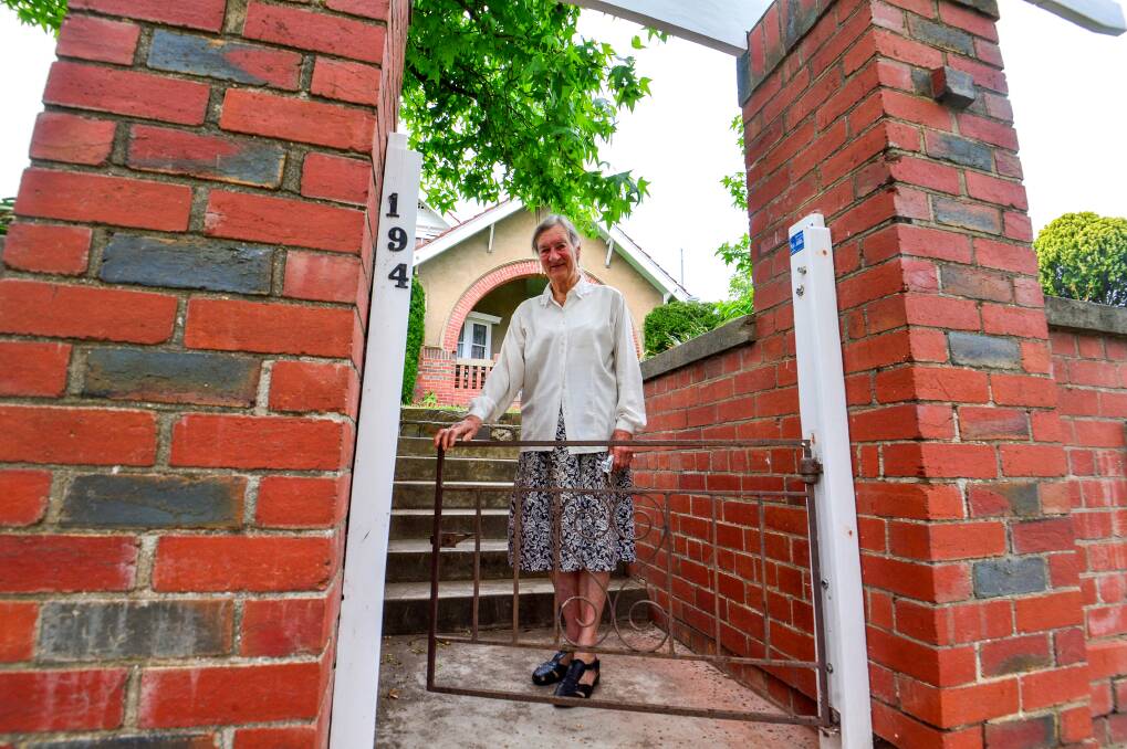Felicity Colthurst at the gate of her 100-year-old Bendigo homel Picture: Darren Howe 