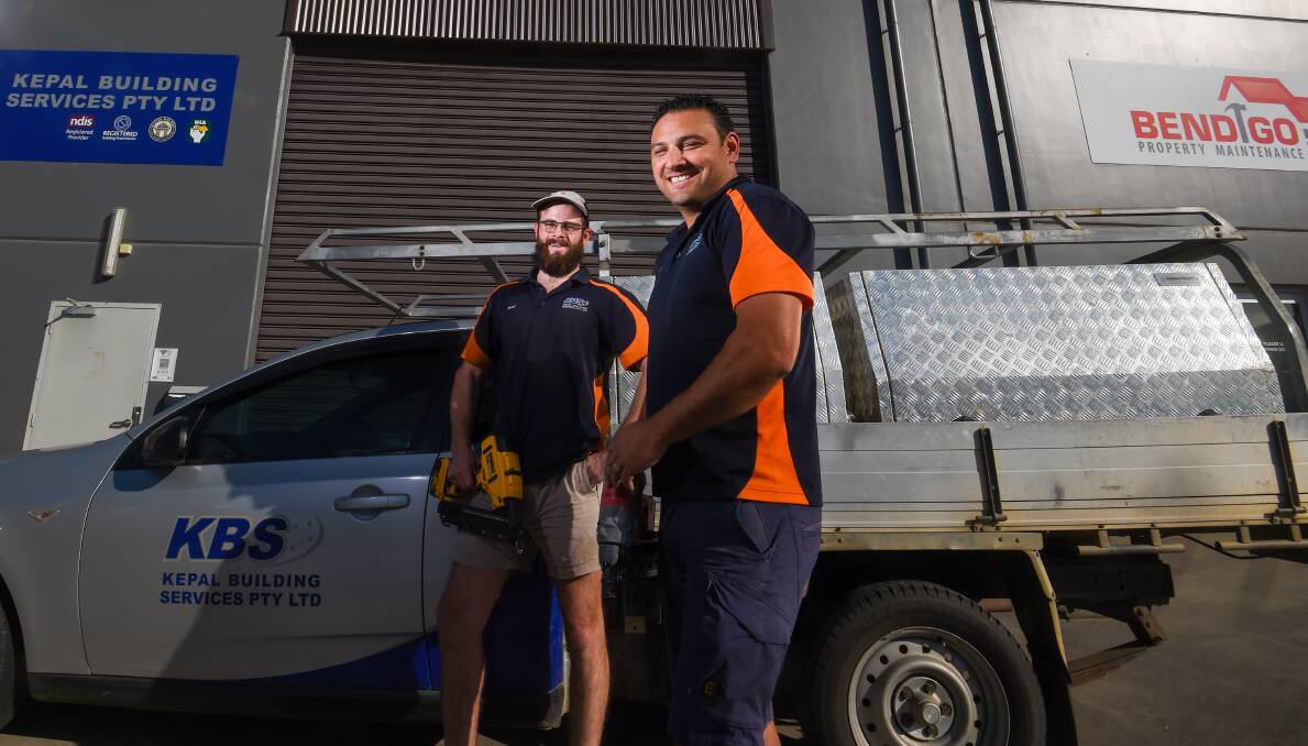 APPLY WITHIN: Carpenters Brad Coutts and Moses Tauelangi want to recruit more tradies to help carry the workload generated by booming demand for building projects. Picture: DARREN HOWE