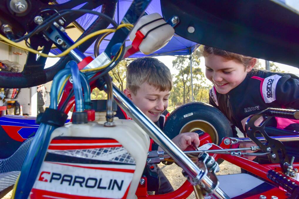 CLOSE INSPECTION: Sam Sidwell and Addy Arnett, both in the Cadet 12 class, take a close look a kart. Picture: BRENDAN MCCARTHY