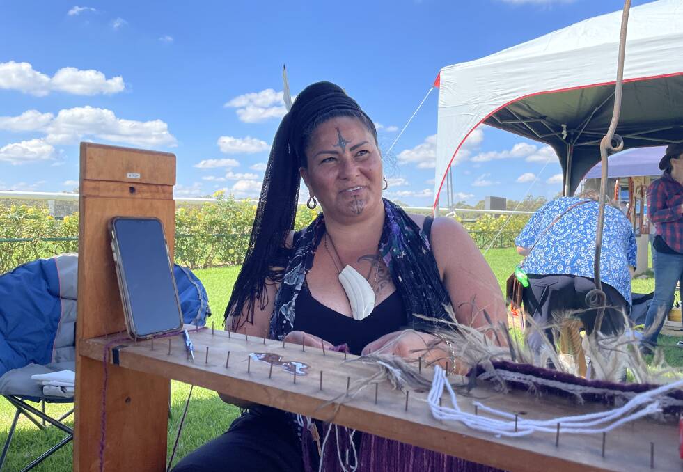 Traditional weaving: Lady Crown demonstrated the ancient cloak making technique at the Lost Trades Fair on Saturday. Picture: JULIEANNE STRACHAN