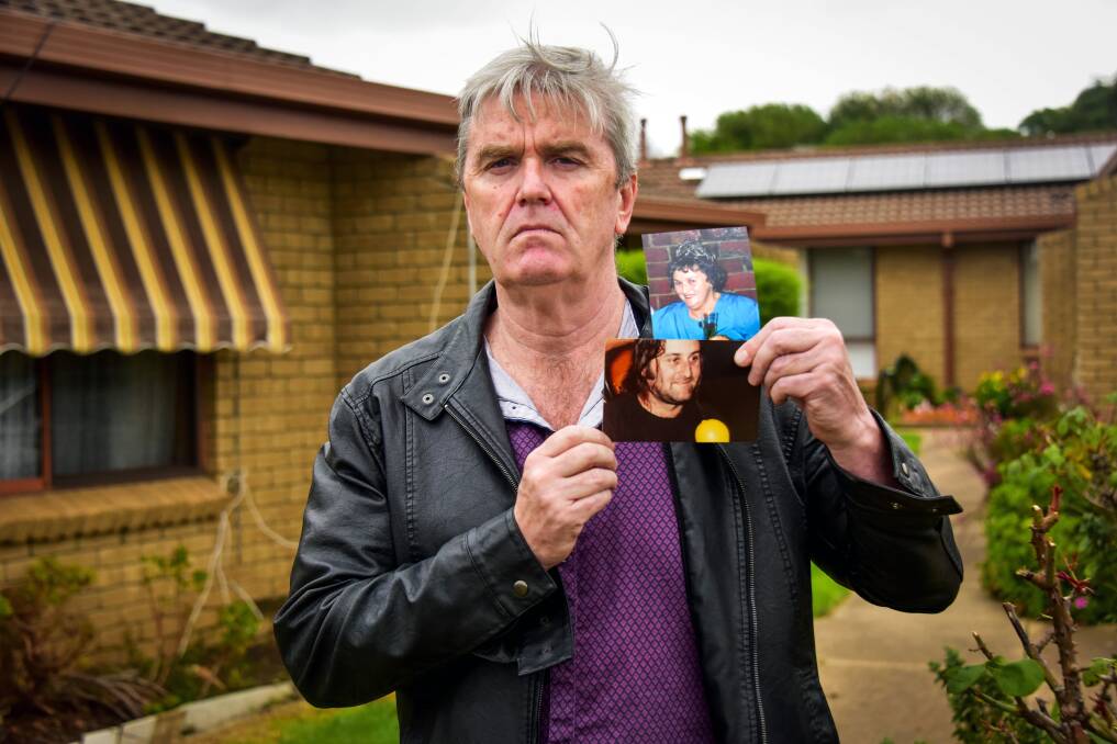 Brian McKenna holds up photos of his brother 'Animal' and his mother, who were both abused by the Catholic church. Picture: BRENDAN McCARTHY