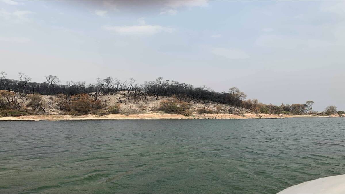 Residents camped on the Tamboon sandbank after escaping the fires. Picture: LAYTON MILLER