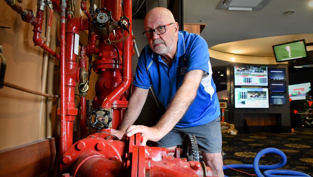 Shamrock Hotel owner Ray Sharawra considers himself lucky after his front bar flooded. Picture: NONI HYETT