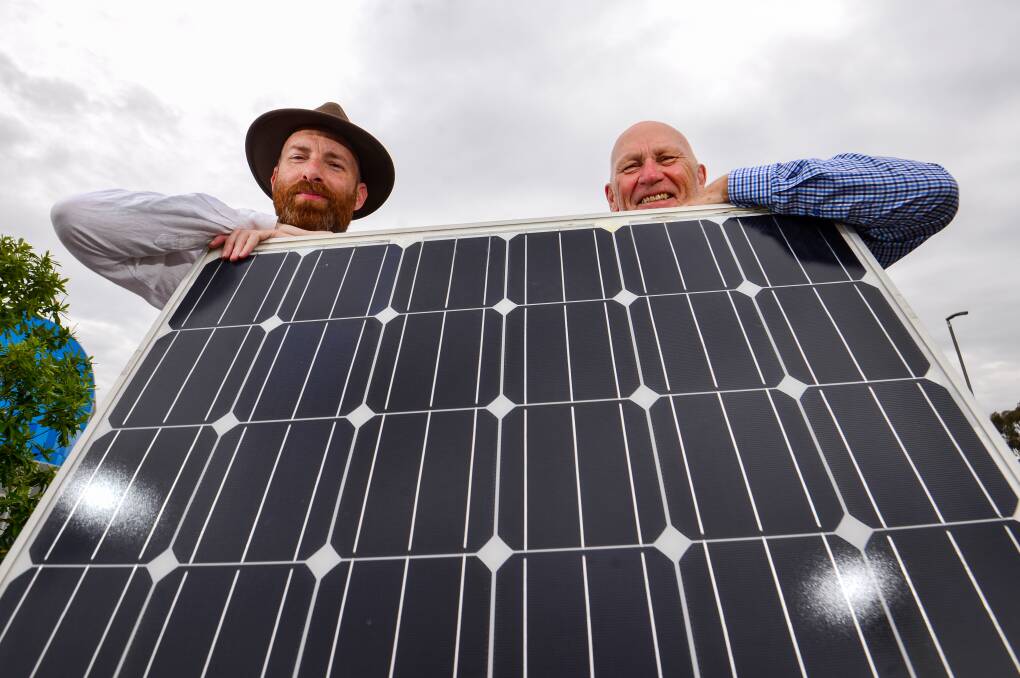 Colin Lambie and Tony O'Loughlin at the Bendigo Stadium solar exhibition in November. Picture: DARREN HOWE
