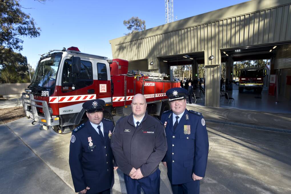 HAPPY DAYS: Members of Junortoun Fire Brigade gathered at the opening of the new station on Friday. Picture: NONI HYETT