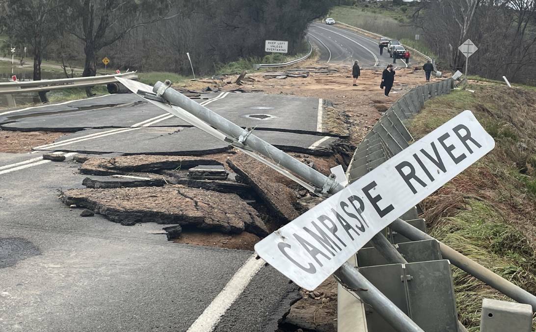 The McIvor Highway at the Axedale bridge suffered damage from the floods. Picture by Chris Pedler.