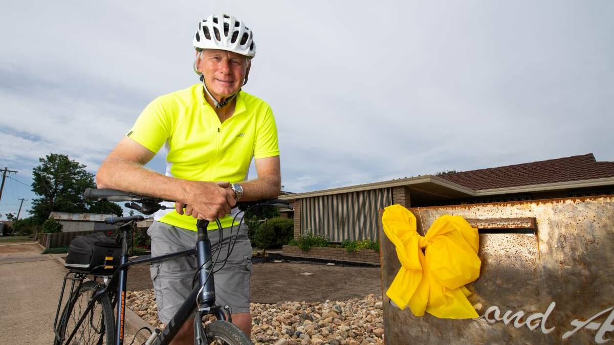 IT WAS ALL YELLOW: Henty resident Bruce Whitlock supporting National Road Safety Week by displaying a yellow bow on his letterbox. Picture: MARK JESSER