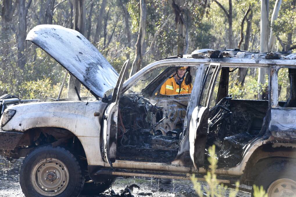 CFA firefighter at the scene of the 4WD car fire in Marong. Picture: NONI HYETT.