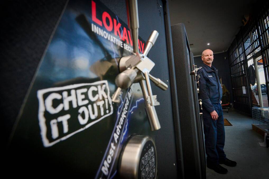 LOCK IT UP: Central Victorian Firearms Officer Leading Senior Constable Mark Wilkinson in front of firearm storage locker at Smiths Outdoors. Picture: DARREN HOWE.