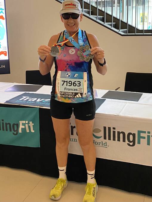 Walsh with her Berlin marathon and Abbotts medals in Berlin. Picture supplied