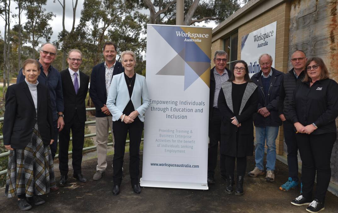 CEO Rebecca Dempsey and director Jim Norris (left) with other Workspace directors, staff and business members and local member Maree Edwards.