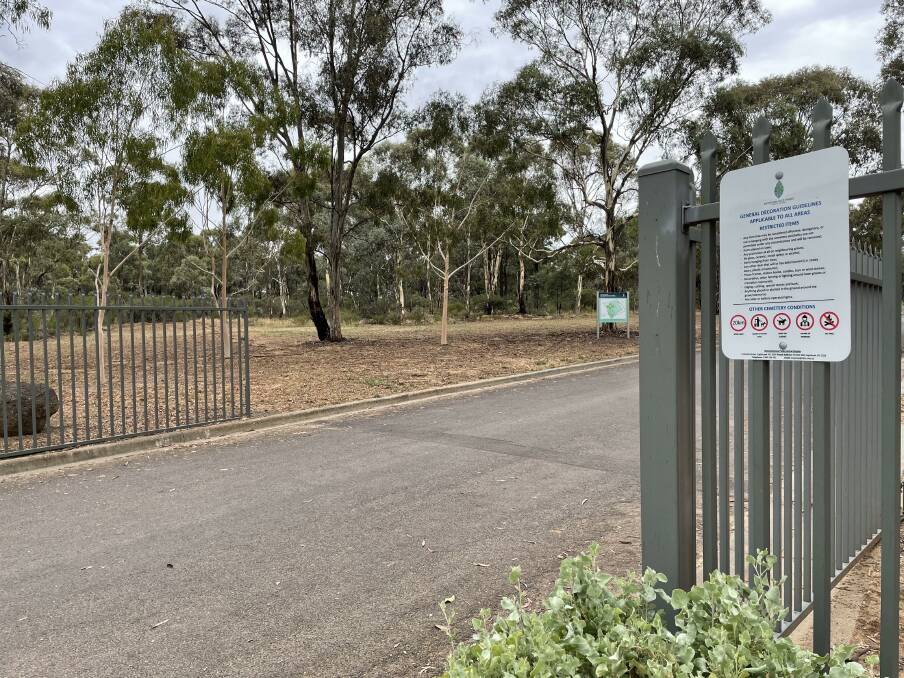 The sign on the front gate at Eaglehawk cemetery, which Remembrance Parks Victoria relied on to inform people about its plans to enforce its grave site adornment policy. 