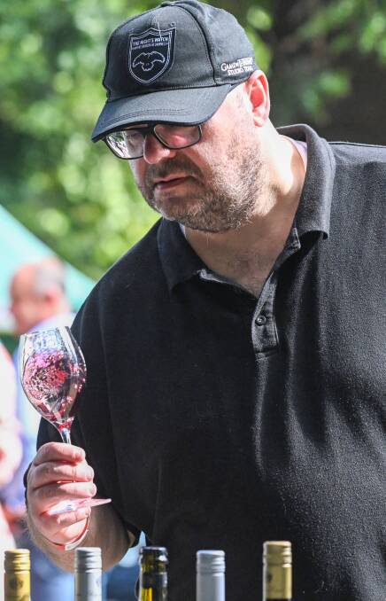 Steven Marrs gives a red his attention at the 2023 Bendigo Winemakers Festival. Picture by Darren Howe.