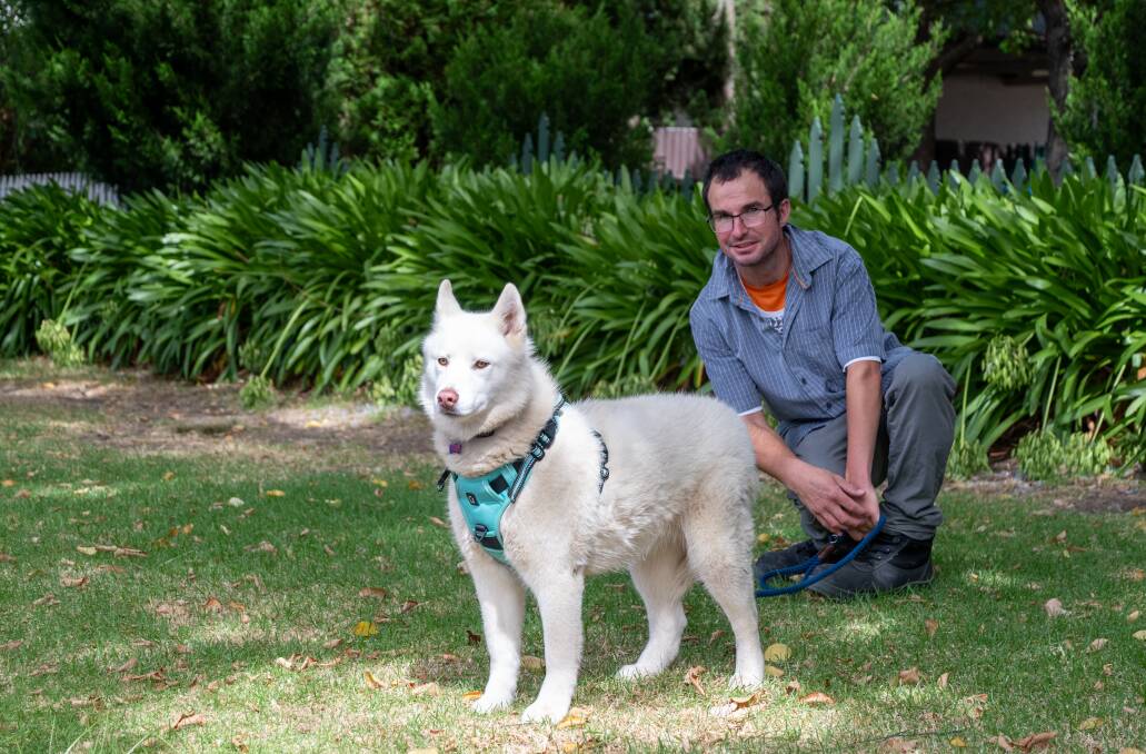 Ryland with his husky Storm, who he has helped with recall issues. Picture by Enzo Tomasiello
