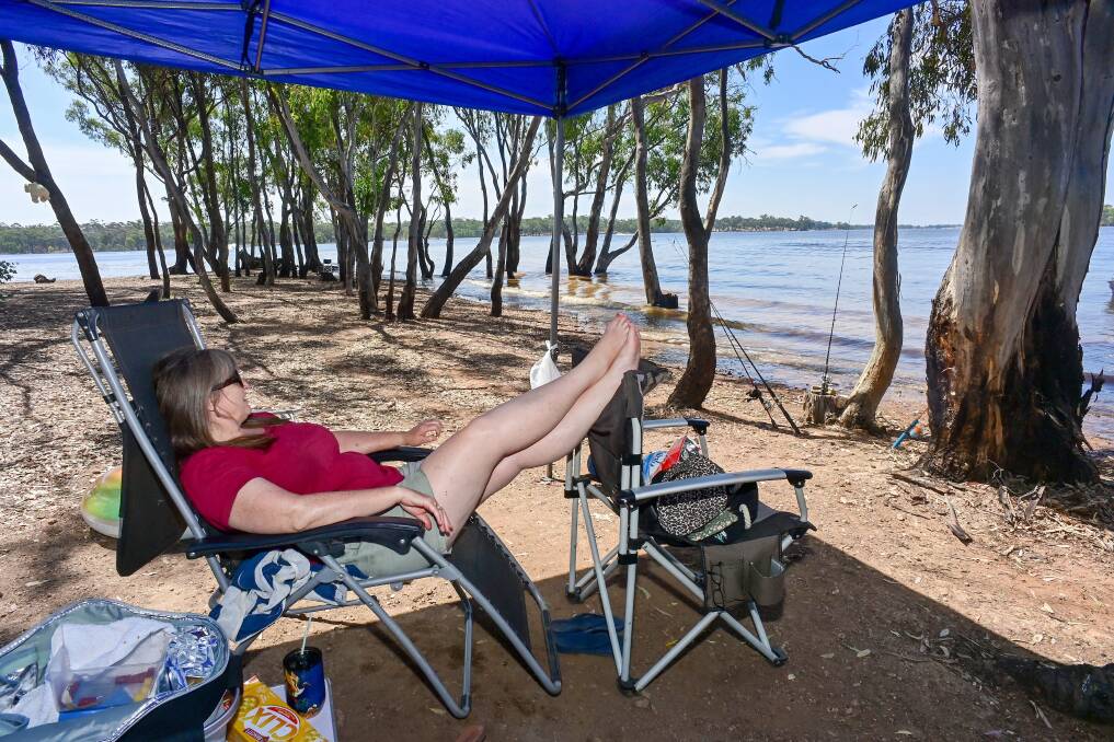Sunbury holidaymaker Kim Durose has been checking the water before swimming in the lake. 
