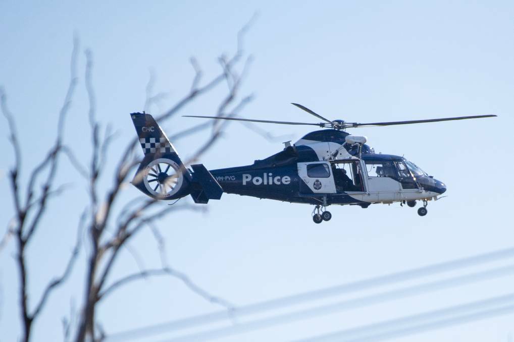 A Victoria Police helicopter flies overhead. File photo