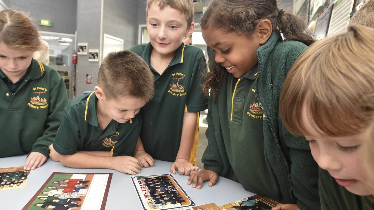 St. Peter's Primary School is celebrating its 50 year anniversary, and students including Harry Wilson, Oliver Ring and Kacey Pickett have enjoyed reflecting on some older school photos. Picture: NONI HYETT