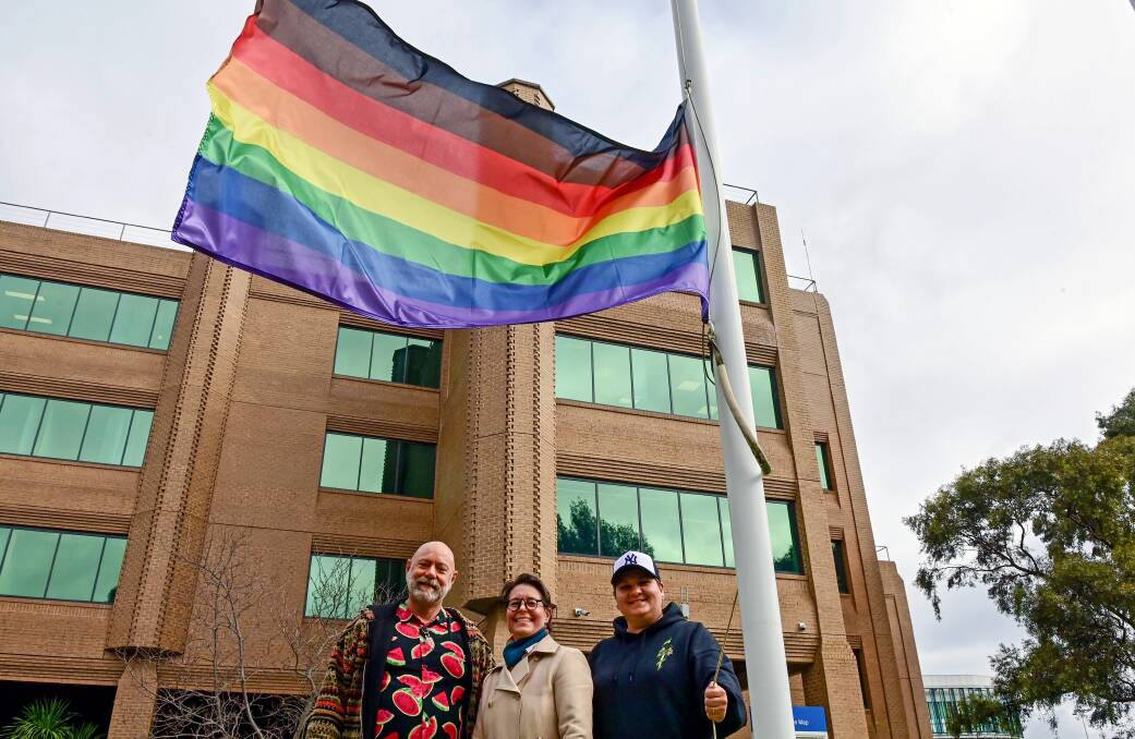 Chris Butler, Dr Julie Rudner and Bee Baker were on site at La Trobe's Bendigo campus to raise the Pride flag this week. Picture: BRENDAN MCCARTHY 