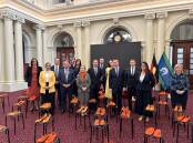Gaelle Broad (left) joins MPs in parliament to stand against gender-based violence - a pair of shoes represents each woman lost to family violence this year. Picture supplied 