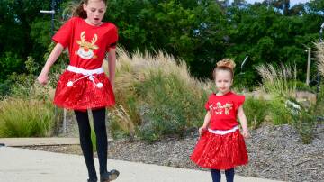 Chloe Wicks and Clara Bonora were some of the Irish dancers at the Community Christmas Carols. Picture by Enzo Tomasiello