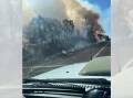 A member of the public sent in this photo, taken by a passenger, as they passed the blaze in Taradale. Picture supplied 