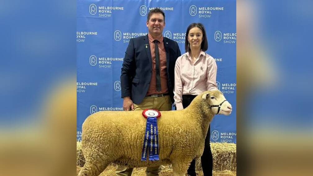 Judge Scott Mitchell and Georgia Brown with the prize-winning ewe herself. Picture supplied 