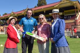 Ben DeAraugo from Cricket Australia presented Diane Robertson with a commemorative bat to honour her great-grandmother's achievements. Darren Howe 