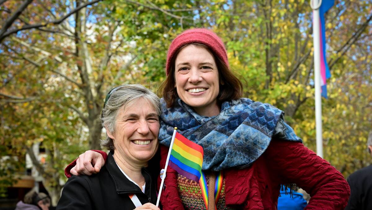 Antoinette Sampson and Bec Lee were among the large crowd of supporters for the IDAHOBIT progress pride and trans flag raising. Picture: Brendan McCarthy 