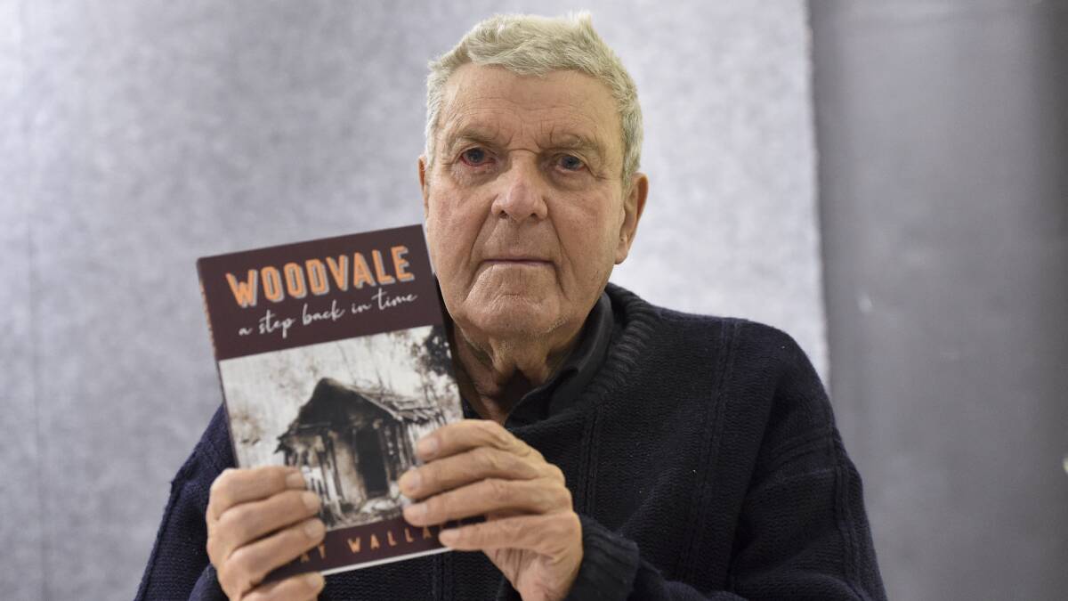 HISTORY: Ray Wallace with his labour of love, 'Woodvale - A Step Back in Time'. Picture: NONI HYETT 