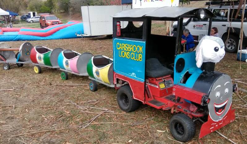 BRINGING JOY: Ian Hoyland's miniature train was created from a ride-on mower and travelled the state, including this 2019 Keeleys Cause event in Ballan. Picture: Facebook. 