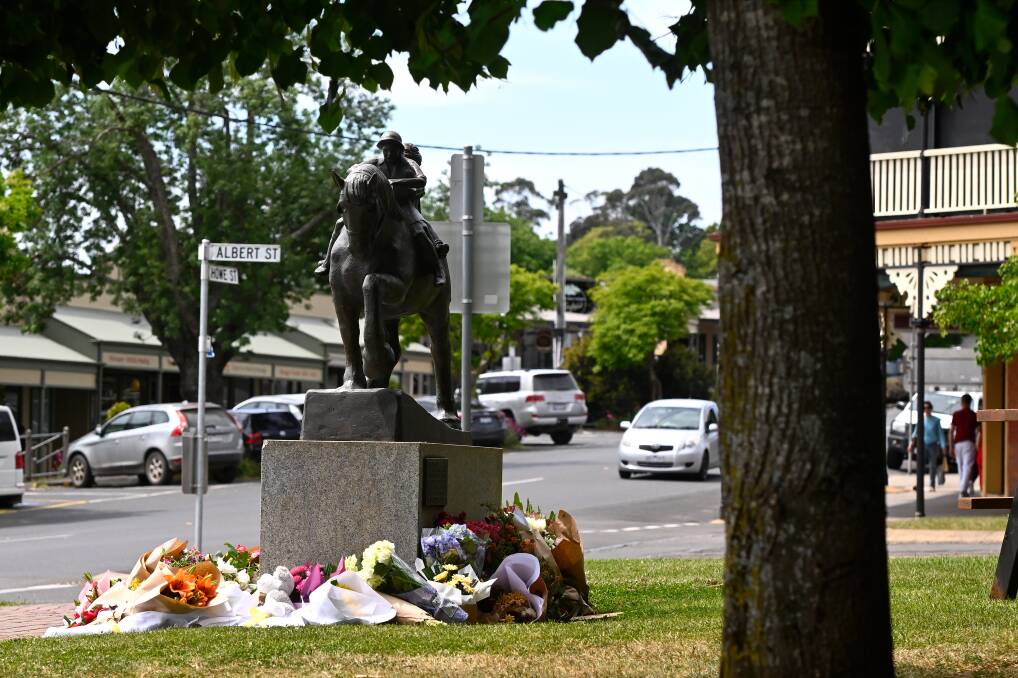 Flowers and toys left at the Daylesford accident scene the next day. The park had just two sparsely-spaced bollards separating it from Albert Street. Picture by Adam Trafford.