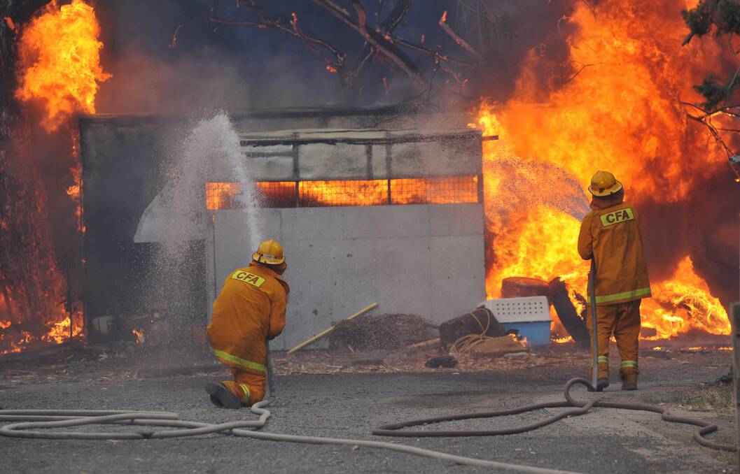 Fire fighters in Maiden Gully on Black Saturday. Picture by Julie Hough