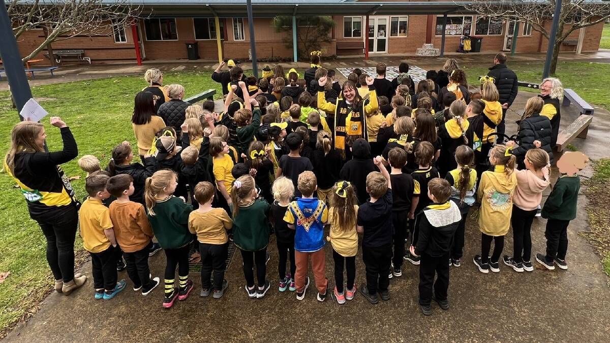 Lockwood Primary School dressed up in Richmond Tigers colours to honour their retiring business manager Fiona Adams. Picture supplied
