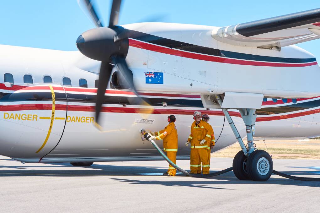 CFA volunteers learning how to quickly reload large airtankers used to fight fires. Picture by CFA Media
