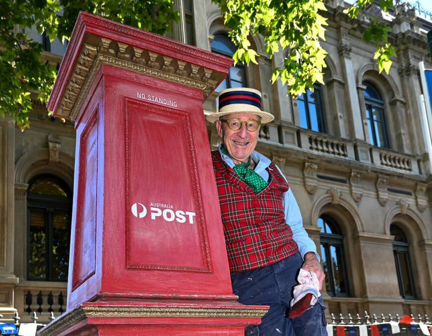 Mick Slocum with the Bendigo Post Office's heritage post box, which he restored on March 28. Picture by Enzo Tomasiello