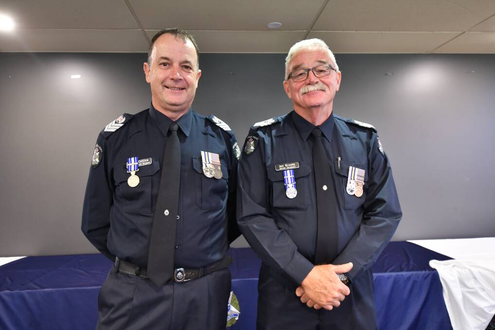 Senior sergeants Dave Collins and Ian Brooks were awarded for their more than 40 years of service to Victoria Police. Picture by Jonathon Magrath