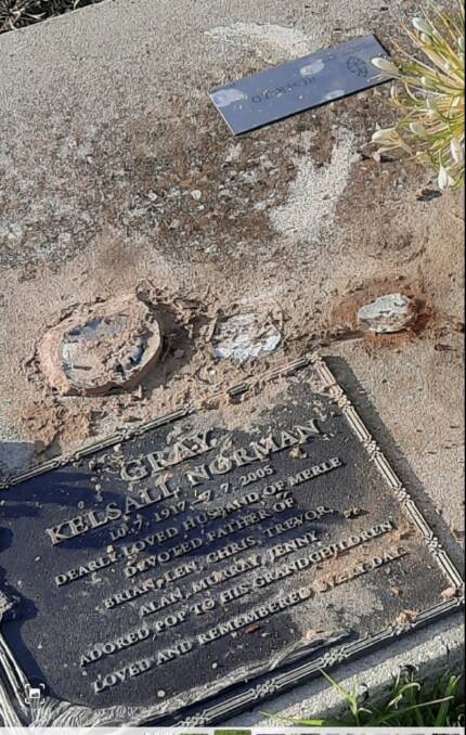 What's left at Jenny Gray's father's headstone after RPCV staff removed several clay vases. Picture supplied.