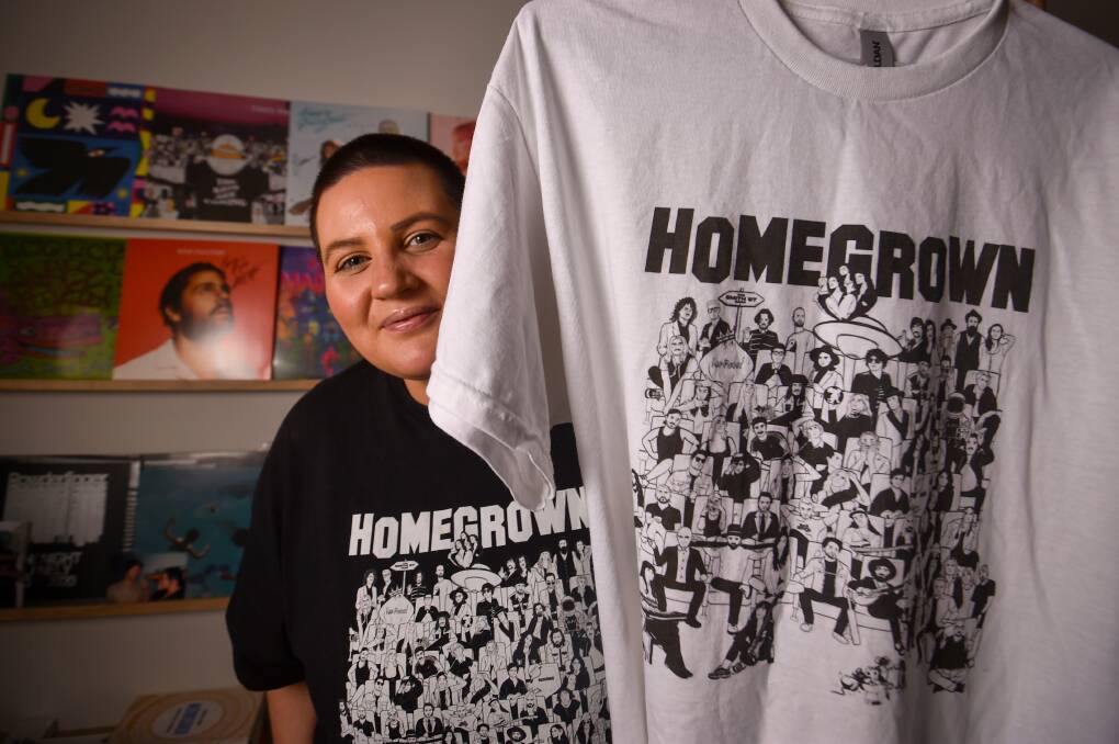 Nomad Create graphic designer Kylie Strachan with the Homegrown t-shirt. Picture by Darren Howe