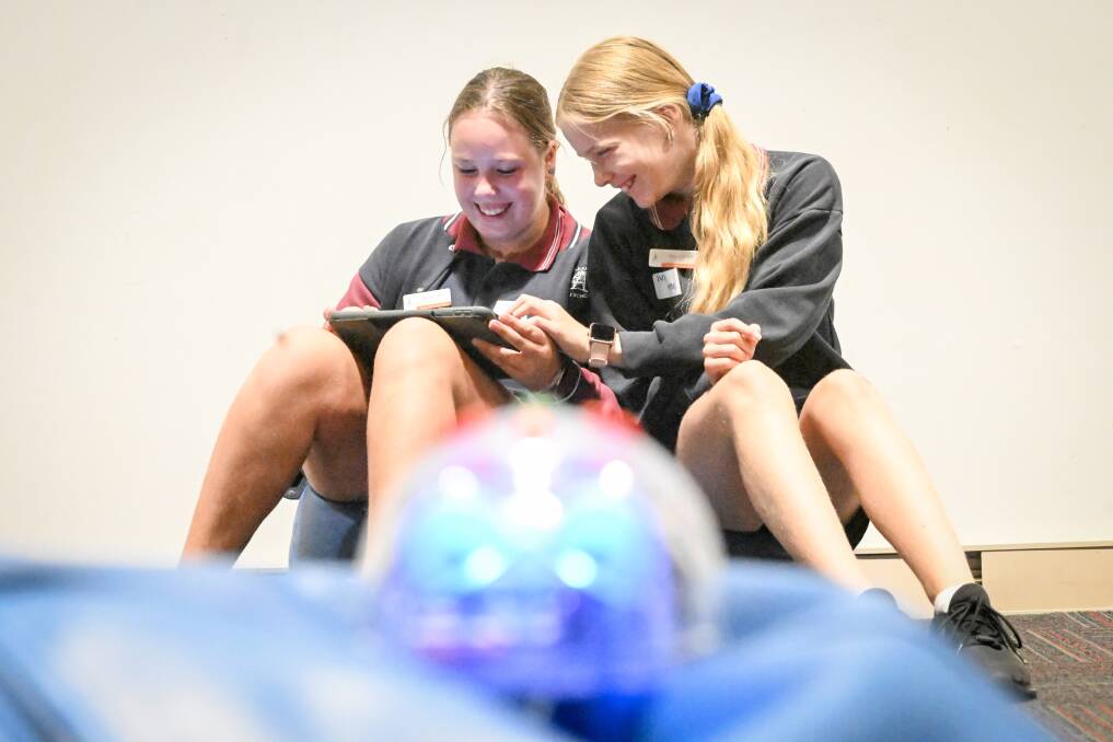 Ivy Plembeck and Mollie Edwards exploring robotics at Discovery's Girls in STEM program. Picture by Darren Howe